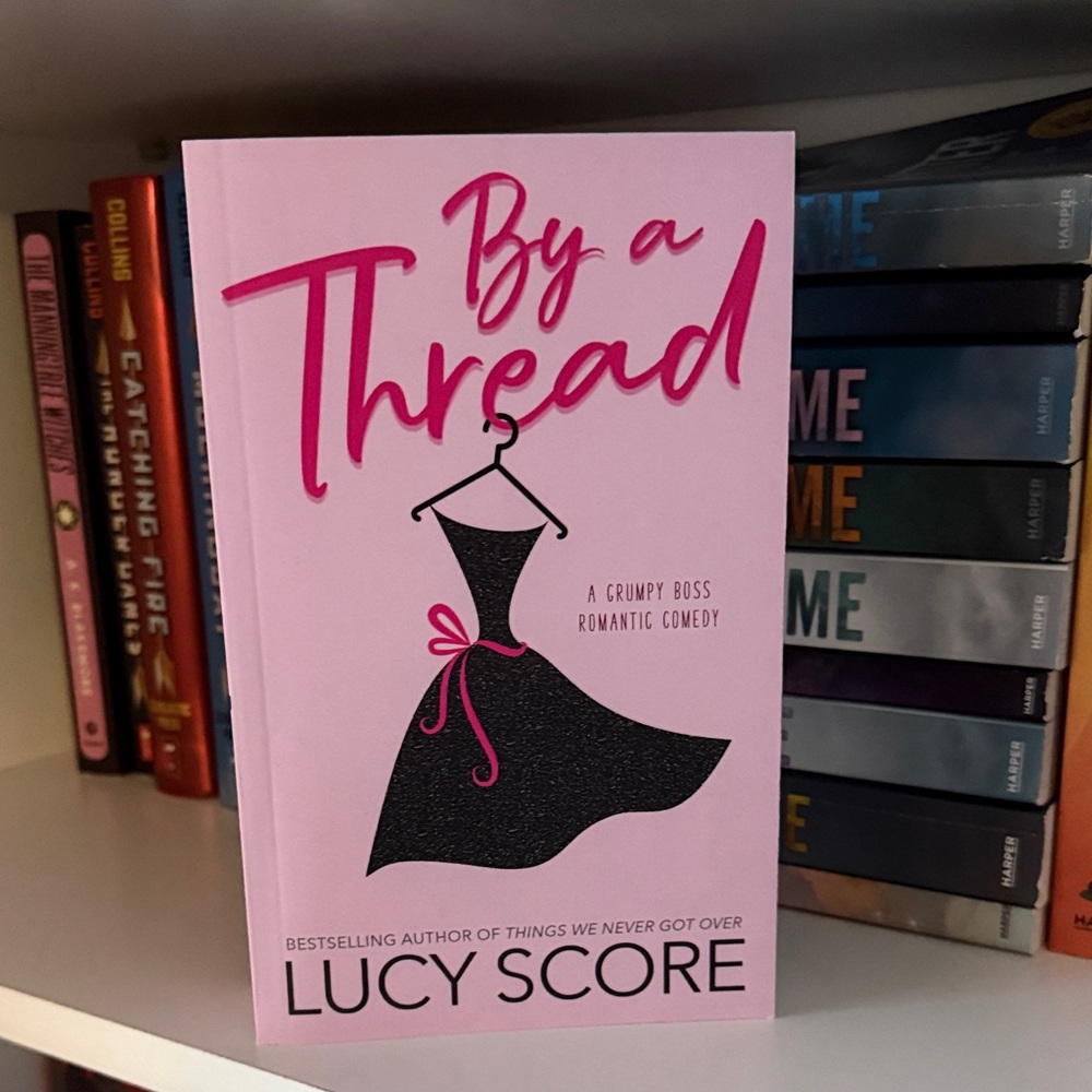 Pink 'By a Thread' Book by Lucy Score